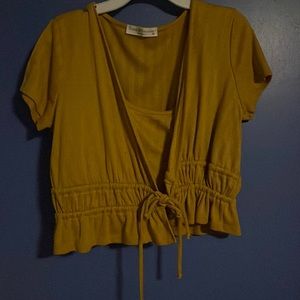 A crop top with a little vest